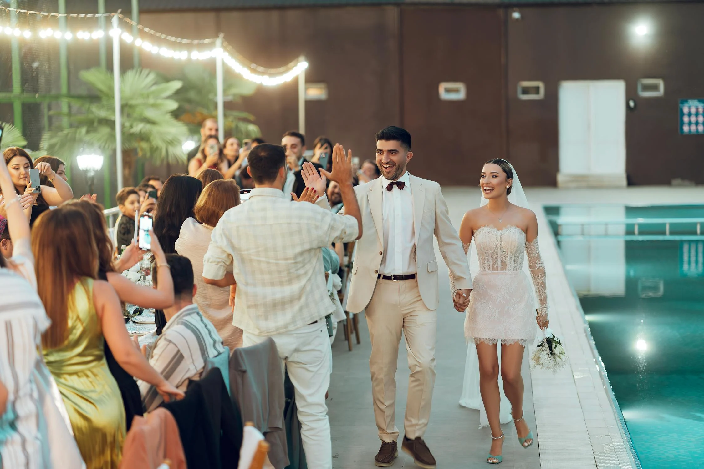 Wedding couple greeting guests